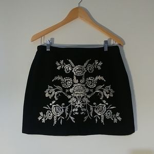 Topshop Moto embroidered black denim skirt.